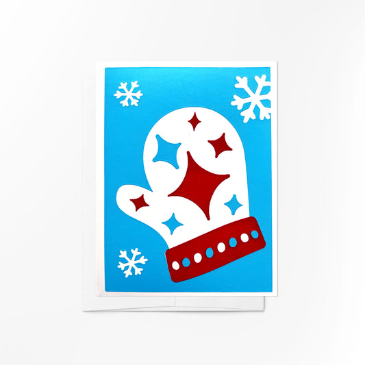 A festive greeting card featuring a cozy mitten with stars  on a bright blue snowy background, designed to spread holiday cheer.
